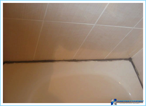 Than to seal the joint between bathtub and tile