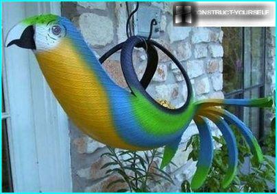 Hanging planter parrot from old tires